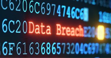 Data breach exposing personal details with a warning sign on a digital screen