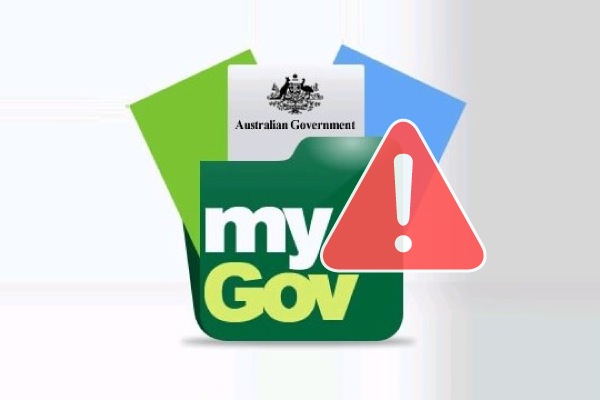 Warning message on a laptop screen about a myGov tax scam email targeting Australian users.