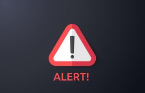 Warning sign on a phone screen showing fake Microsoft 1800 scam targeting Australians, highlighting cybersecurity awareness.